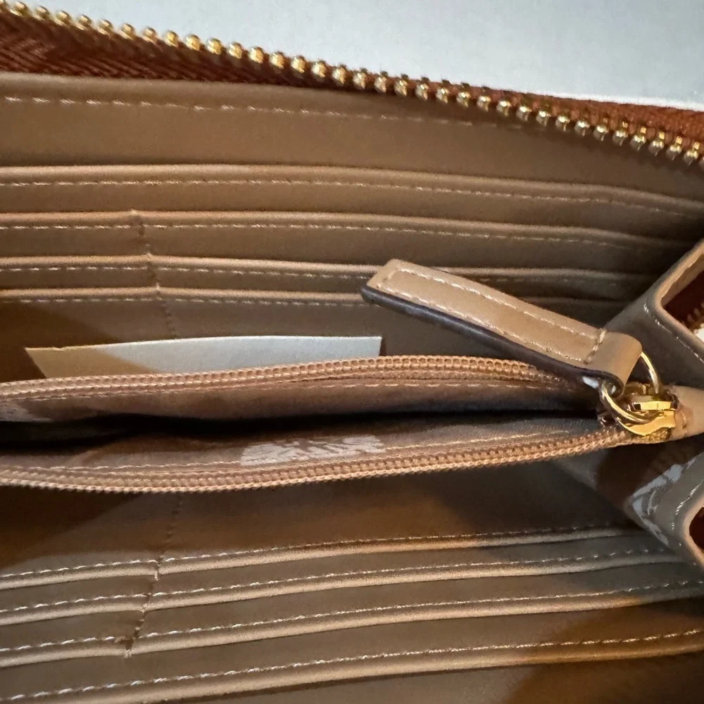Anne Klein AK Logo Slim Zip Around Wallet in a two-tone Cream and Brown/Saddle